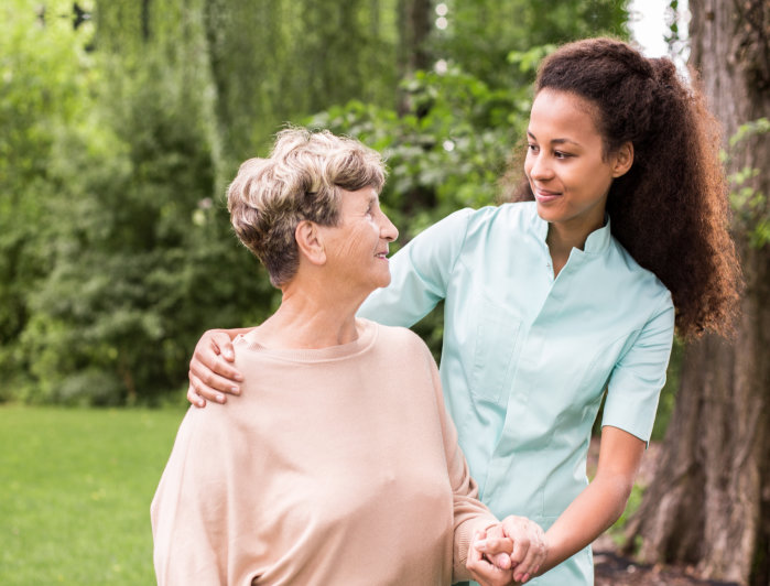 caregiver assist her patient