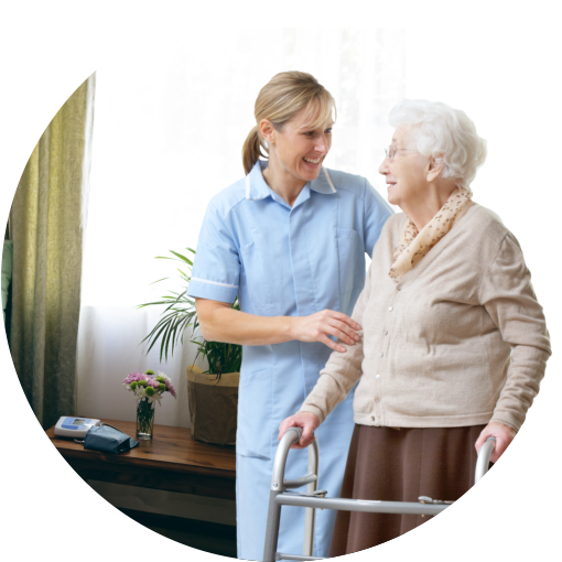caregiver helping elderly in dressing
