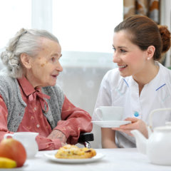 caregiver and patient eat breakfast