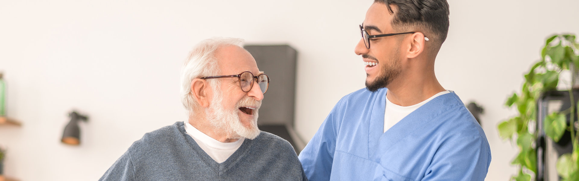 caregiver and patient smile at each other